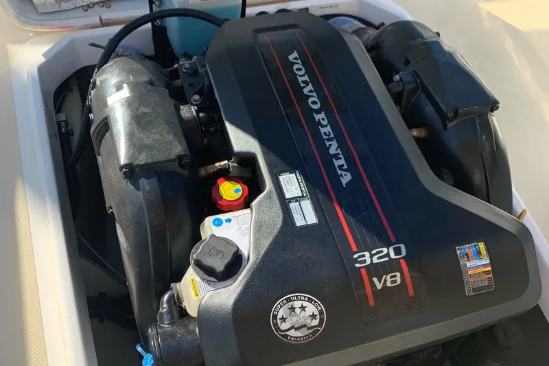 Slide: The Image of Engine compartment of a 2013 Hunt Yachts Harrier 25, featuring a Volvo Penta engine. - 10