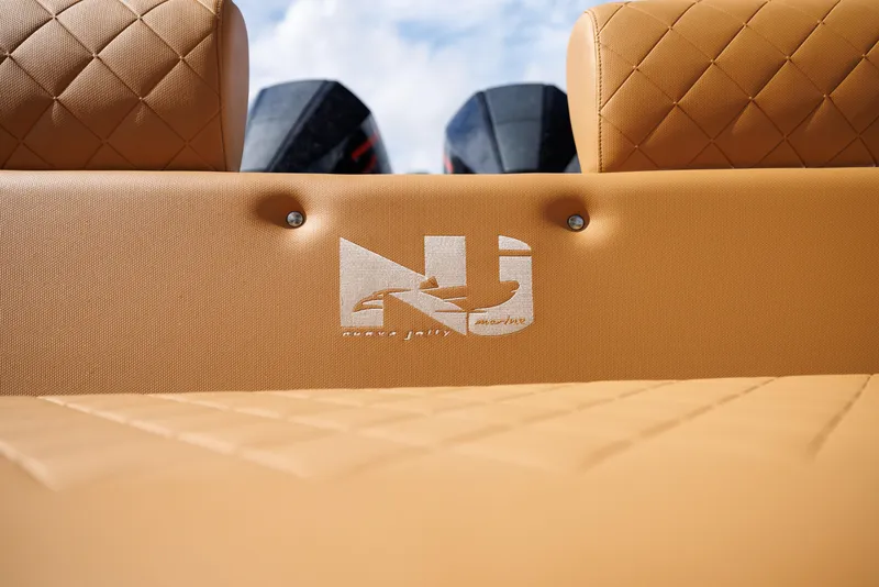 Slide: The Image of Nuova Jolly Prince 38, 2024 model, tan quilted seating with logo, outboard motors visible. - 11