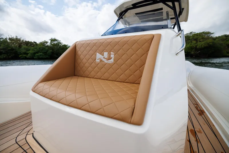 Slide: The Image of 2024 Nuova Jolly Prince 38 boat with tan quilted seating and sleek design. - 15