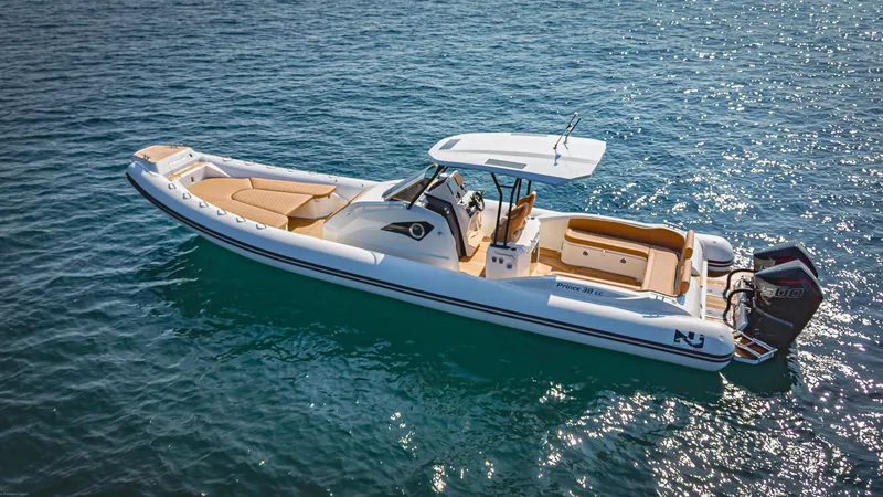 Slide: The Image of 2024 Nuova Jolly Prince 38 boat on clear blue water. - 2