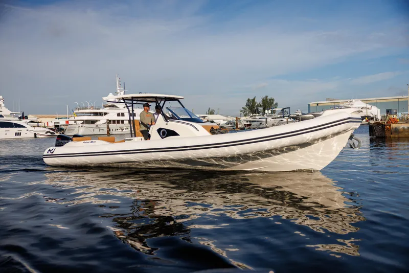 Slide: The Image of 2024 Nuova Jolly Prince 38 boat on calm water, docked at a marina. - 21