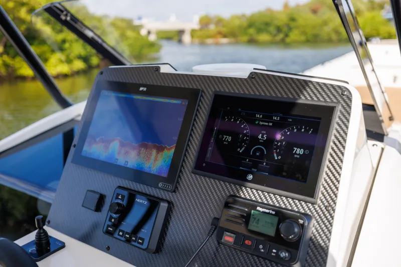 Slide: The Image of 2024 Nuova Jolly Prince 38 dashboard with advanced navigation displays on a scenic river. - 27