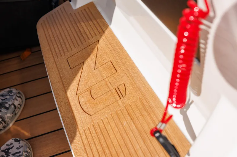 Slide: The Image of Nuova Jolly Prince 38, 2024 model, teak deck detail with red safety cord. - 28