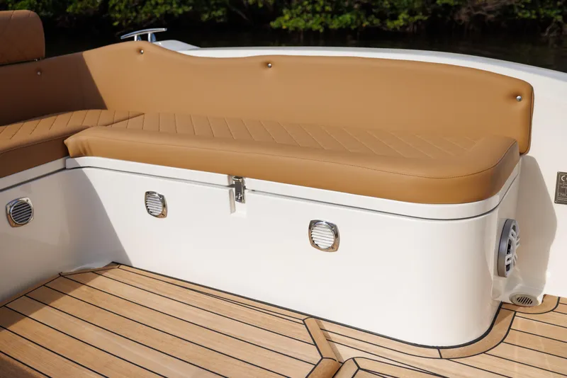 Slide: The Image of Luxurious seating on 2024 Nuova Jolly Prince 38 boat with tan cushions and teak flooring. - 33
