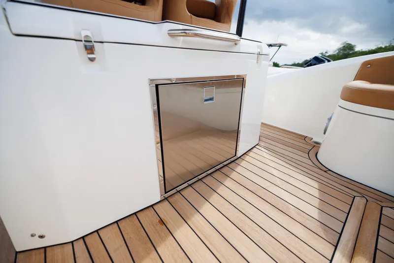Slide: The Image of 2024 Nuova Jolly Prince 38 boat interior with sleek wood flooring and modern cabinetry. - 8