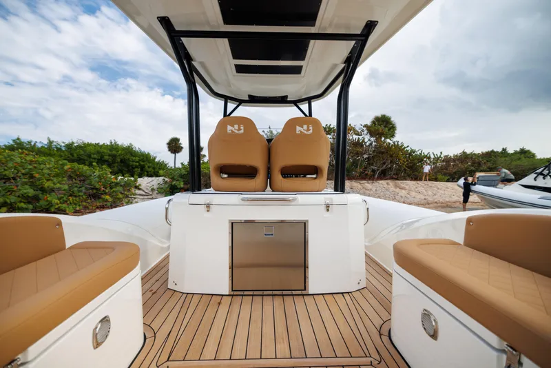 Slide: The Image of 2024 Nuova Jolly Prince 38 boat interior with tan seating and sleek design. - 9