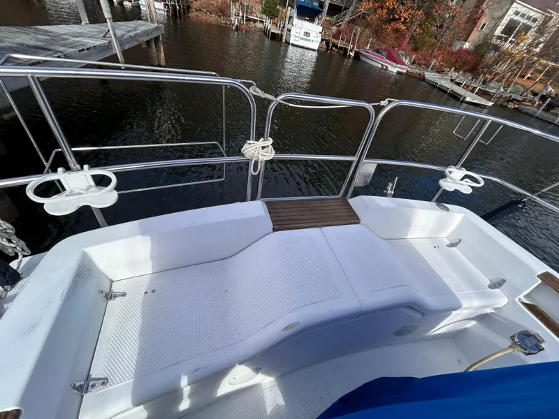 Slide: The Image of Cockpit view of 1983 Hunter 34 sailboat docked by the water. - 10