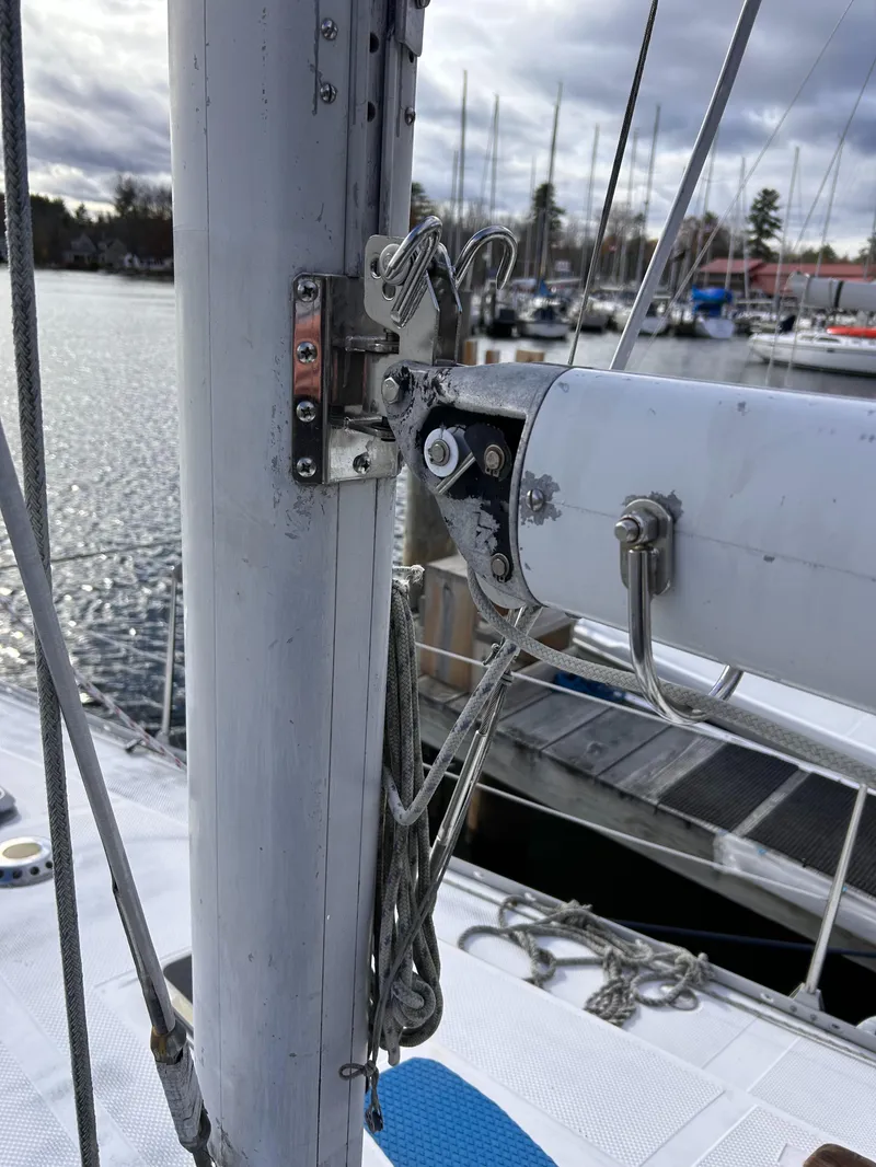 Slide: The Image of Close-up of a 1983 Hunter 34 sailboat mast and rigging at a marina. - 22