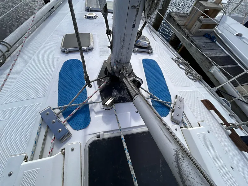 Slide: The Image of 1983 Hunter 34 sailboat deck with rigging and blue non-slip pads. - 23