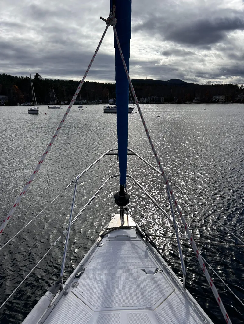 Slide: The Image of Sailboat on a lake under cloudy skies, Hunter 34 model, 1983. - 8