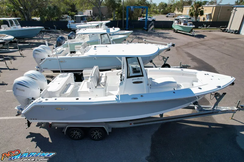 Slide: The Image of 2025 Sea Hunt Gamefish 27 with Coffin Box on trailer in a boatyard. - 10
