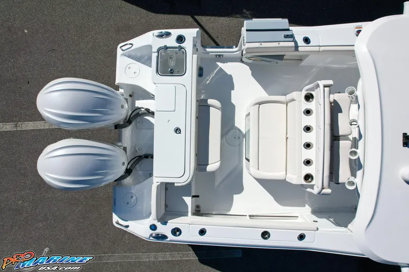 Slide: The Image of Aerial view of 2025 Sea Hunt Gamefish 27 boat with twin engines and coffin box. - 12