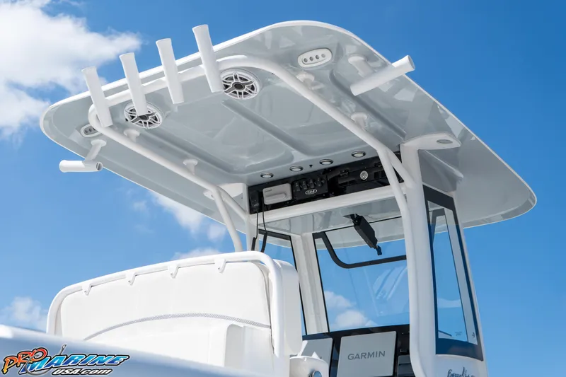 Slide: The Image of 2025 Sea Hunt Gamefish 27 boat with T-top and Garmin electronics against blue sky. - 28