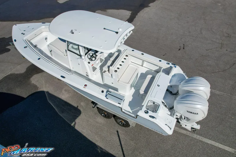 Slide: The Image of 2025 Sea Hunt Gamefish 27 boat with coffin box and twin Yamaha engines. - 3