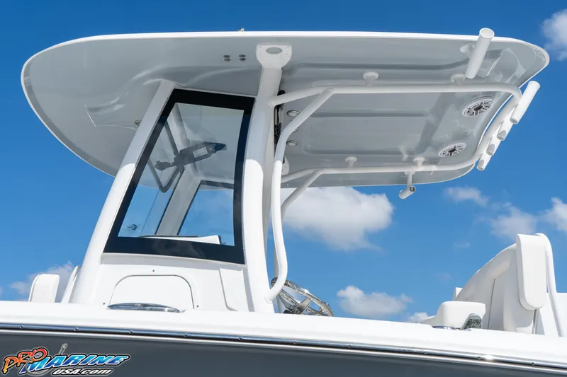 Slide: The Image of 2025 Sea Hunt Gamefish 27 boat with T-top and clear skies. - 30