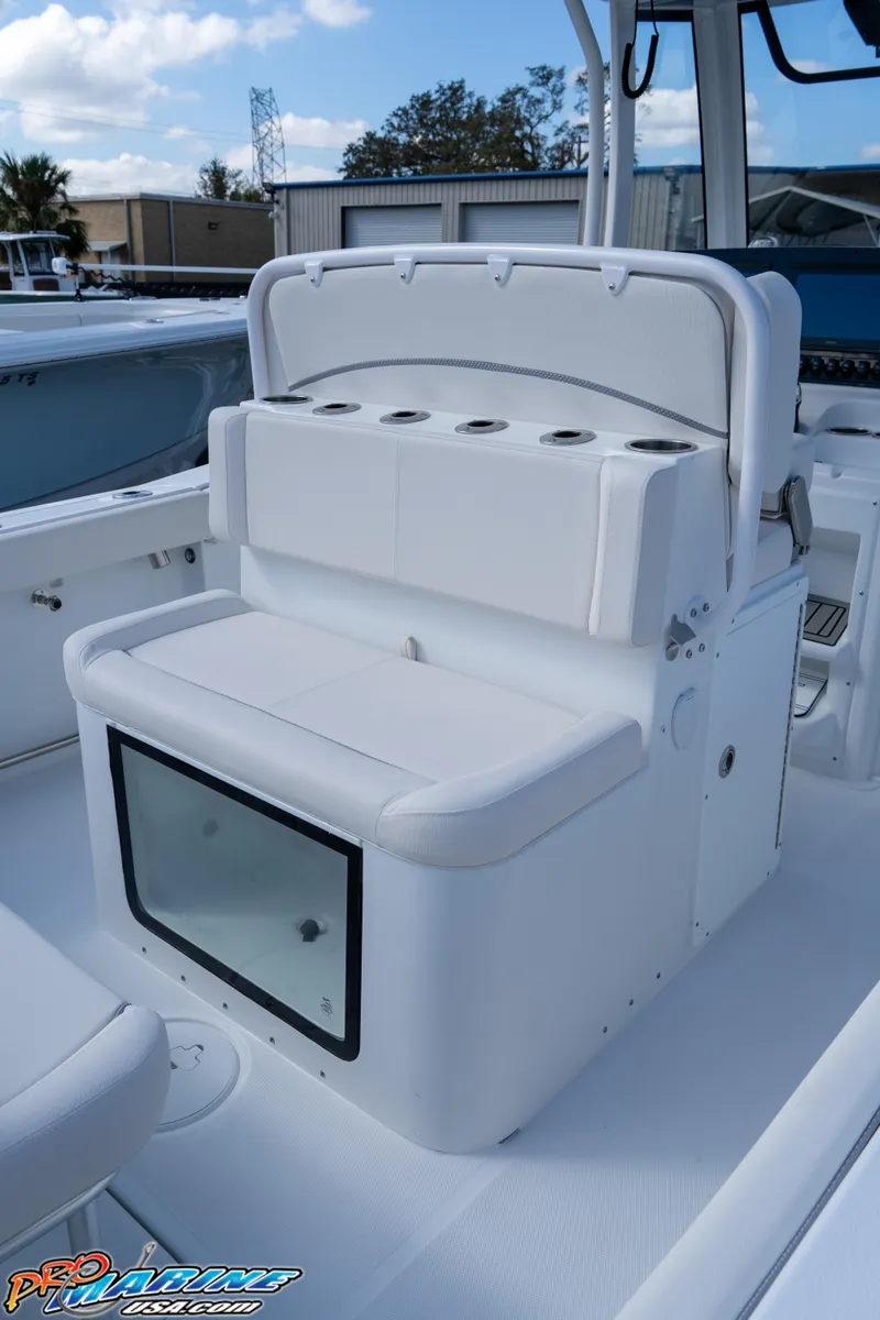Slide: The Image of 2025 Sea Hunt Gamefish 27 with Coffin Box, featuring sleek white seating and storage. - 35