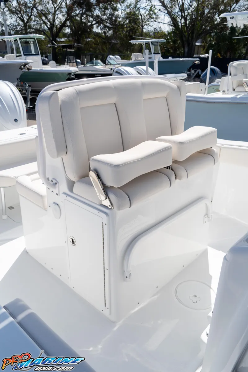 Slide: The Image of 2025 Sea Hunt Gamefish 27 boat seating with coffin box, white upholstery. - 39