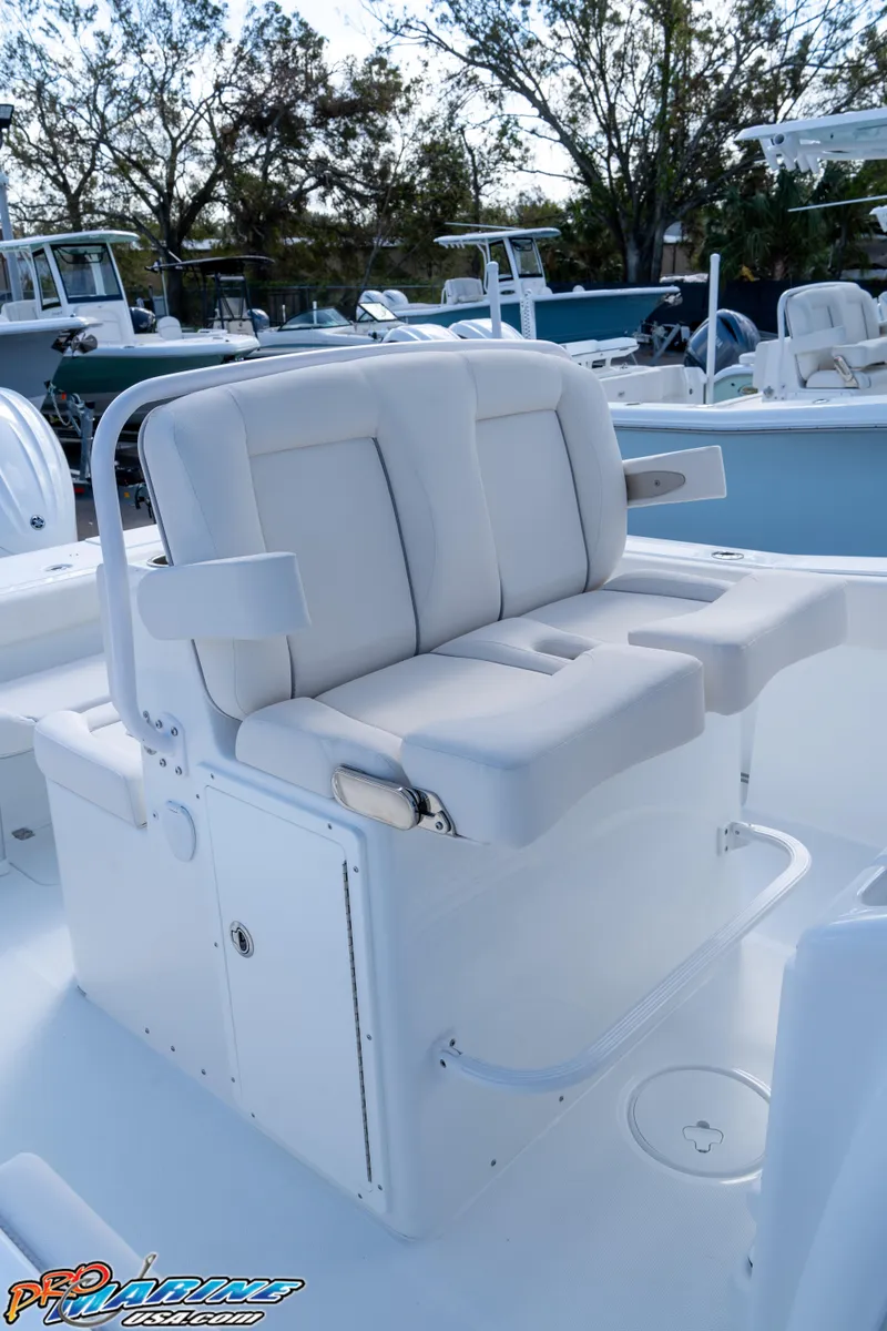 Slide: The Image of 2025 Sea Hunt Gamefish 27 boat seating with coffin box, white upholstery. - 40