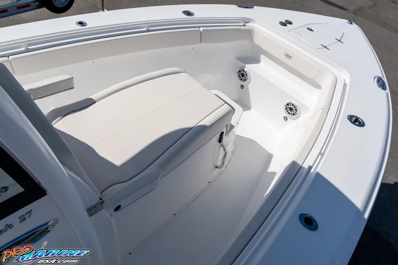 Slide: The Image of 2025 Sea Hunt Gamefish 27 boat interior with coffin box seating and speakers. - 43
