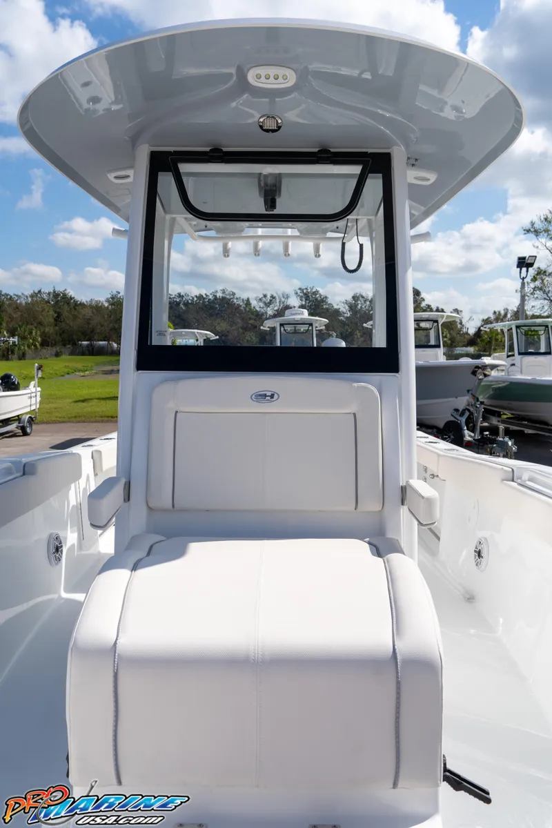 Slide: The Image of 2025 Sea Hunt Gamefish 27 with Coffin Box, sleek design, center console, outdoor setting. - 47