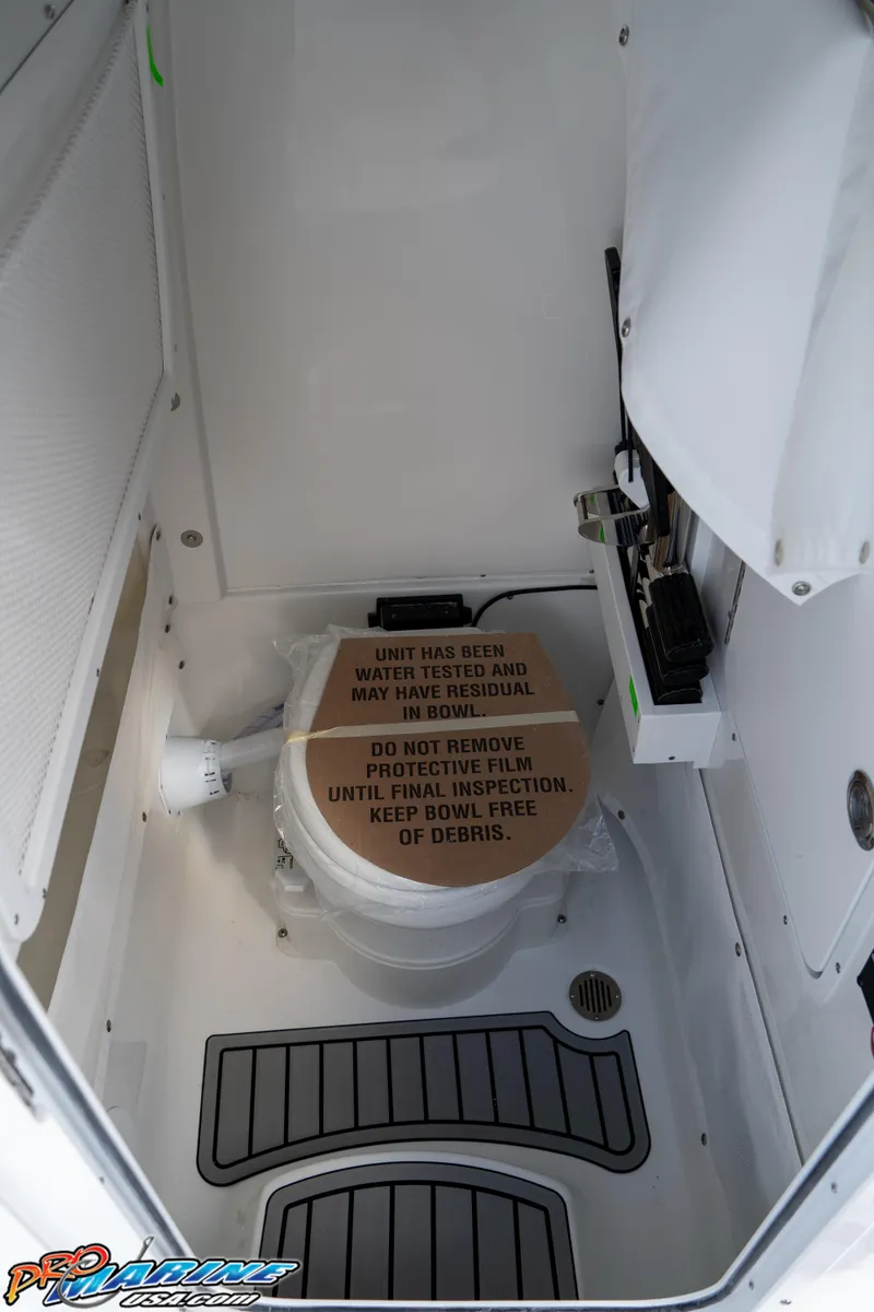 Slide: The Image of 2025 Sea Hunt Gamefish 27 interior with protective covering on equipment. - 48