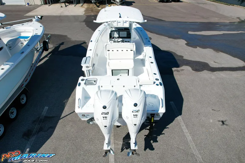 Slide: The Image of 2025 Sea Hunt Gamefish 27 boat with twin 250 V6 engines, aerial view. - 6