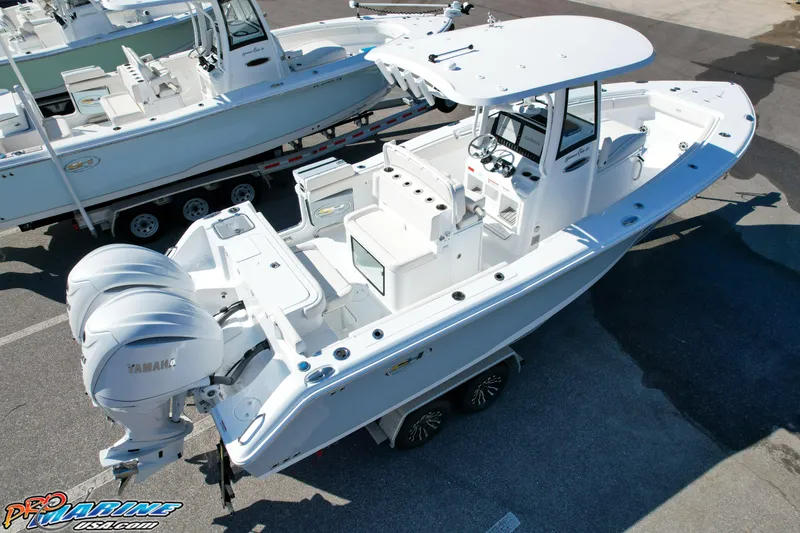 Slide: The Image of 2025 Sea Hunt Gamefish 27 boat with coffin box, dual engines, and spacious deck. - 8