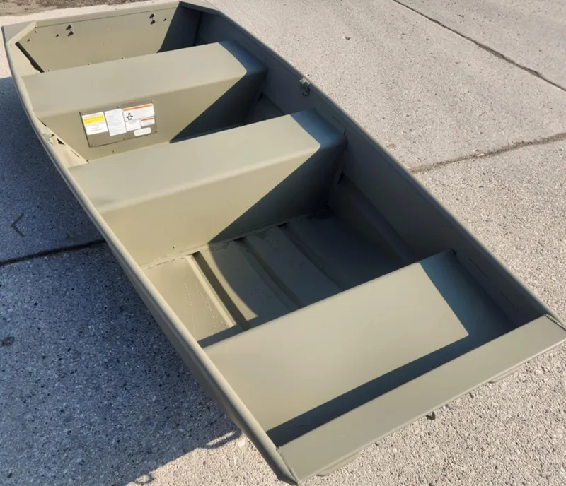 The Image of 2025 Tracker Grizzly 1036 Utility boat on concrete surface. - 0