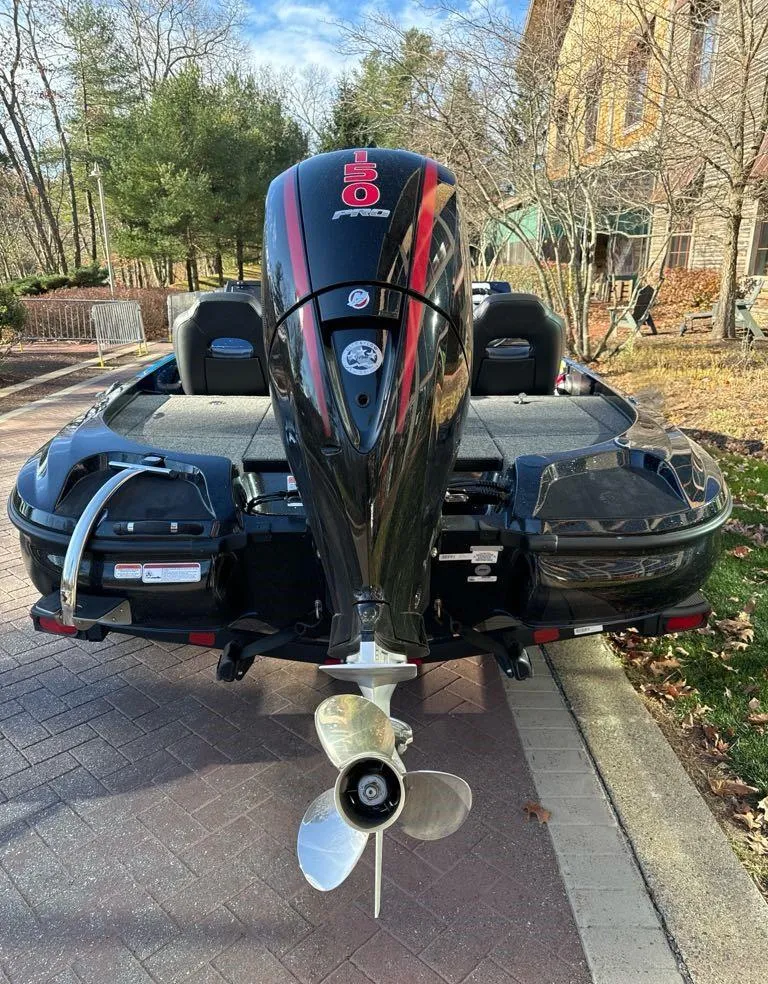 Slide: The Image of 2025 Nitro Z18 boat with powerful outboard motor, parked on a brick driveway. - 3