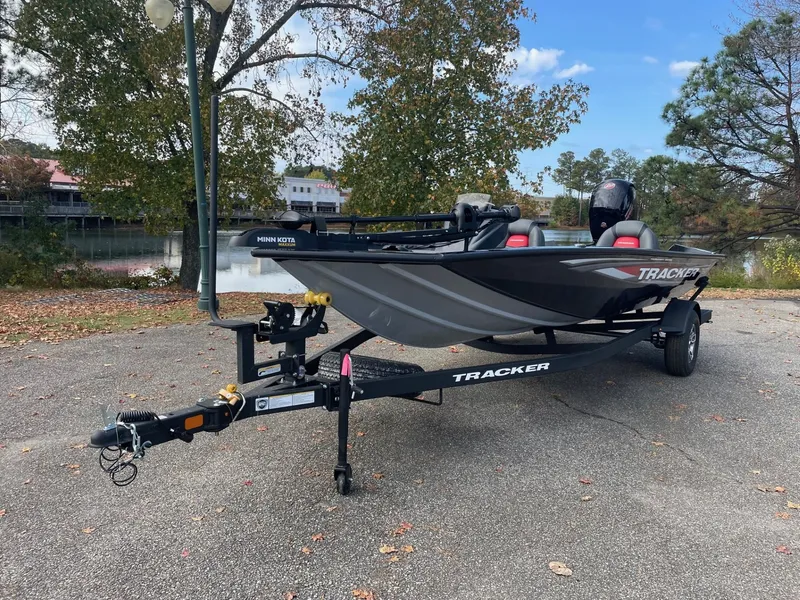 The Image of 2025 Tracker Pro Team 195 Tournament Edition boat on trailer, parked outdoors. - 0