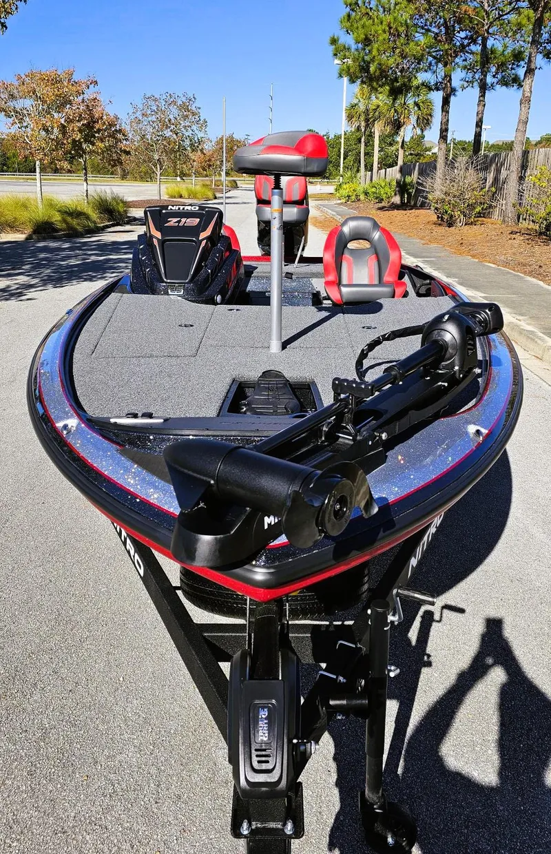 Slide: The Image of 2025 Nitro Z19 fishing boat with modern design on a sunny day. - 6