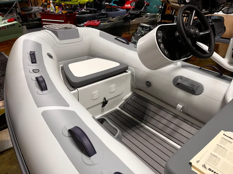 Slide: The Image of 2025 Highfield Classic 310 FCT inflatable boat interior with steering console and seating. - 16