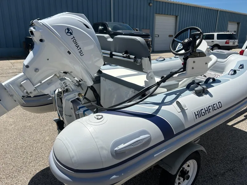The Image of 2025 Highfield Classic 310 FCT inflatable boat with Tohatsu outboard motor. - 2