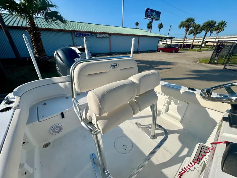 Slide: The Image of 2023 Sea Hunt Ultra 219 boat interior with seating and steering console. - 17