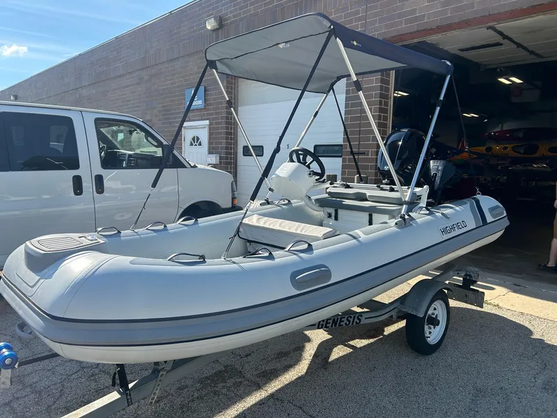 Slide: The Image of 2023 Highfield Classic 380 FCT inflatable boat on trailer, parked outside a garage. - 7