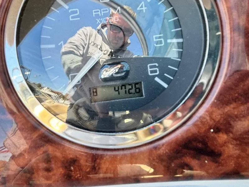 Slide: The Image of Reflection on Sea Ray 240 Sundeck tachometer, showing 472.6 hours, 2002 model. - 14