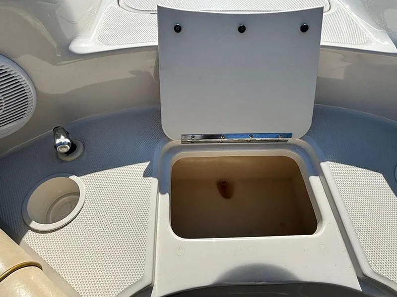 Slide: The Image of Open storage compartment on 2002 Sea Ray 240 Sundeck boat deck. - 19