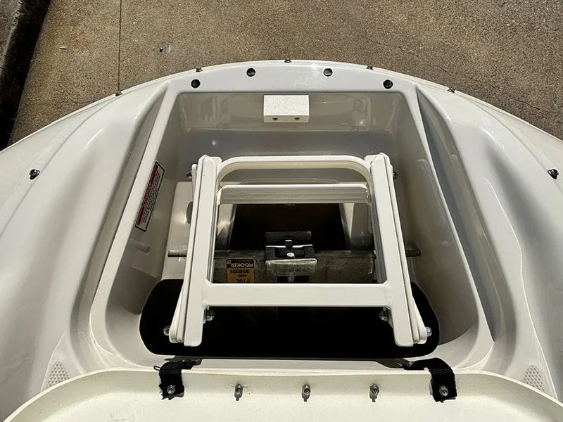 Slide: The Image of 2002 Sea Ray 240 Sundeck bow storage compartment with ladder. - 20