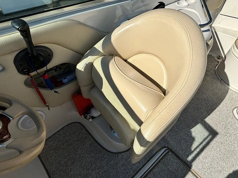 Slide: The Image of Beige captain's chair on 2002 Sea Ray 240 Sundeck boat interior. - 6