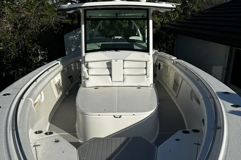 Slide: The Image of 2014 Boston Whaler 370 Outrage boat interior, featuring spacious seating and modern design. - 7