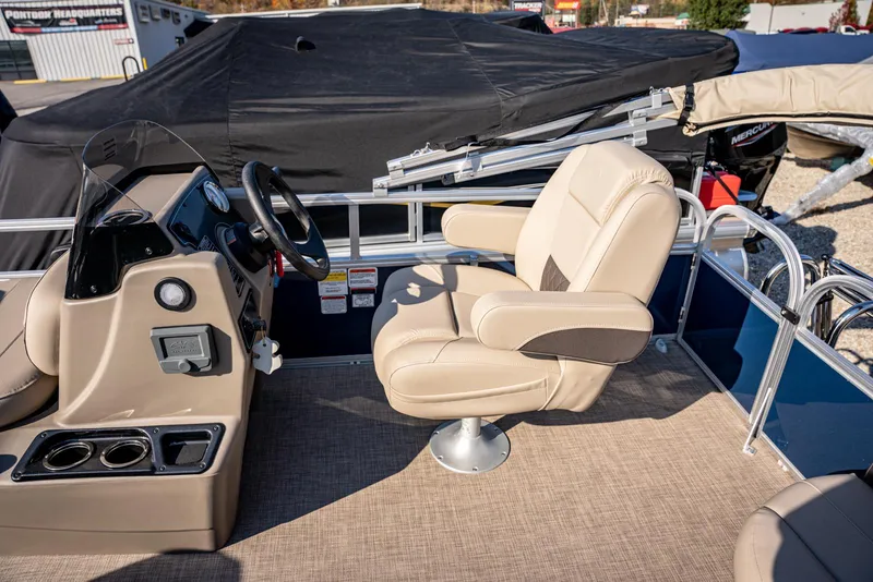 Slide: The Image of 2025 Sun Tracker Bass Buggy 16 DLX boat interior with captain's chair and console. - 8