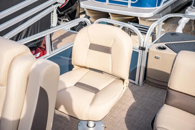 Slide: The Image of 2025 Sun Tracker BASS BUGGY 18 boat interior with beige seating. - 12