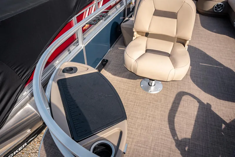 Slide: The Image of 2025 Sun Tracker BASS BUGGY 18 interior with beige seating and fishing station. - 7