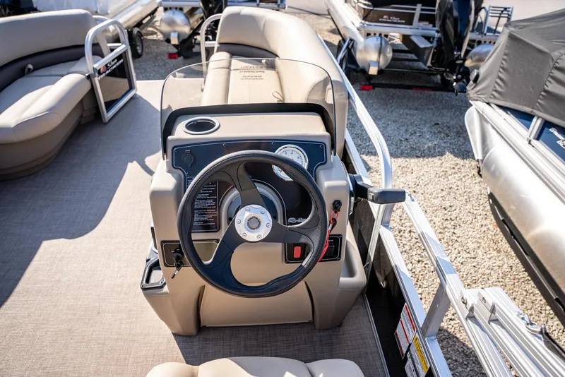 Slide: The Image of 2025 Sun Tracker Party Barge 16 steering console with comfortable seating. - 11