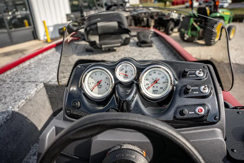 Slide: The Image of Dashboard of 2025 Bass Tracker Pro Team 170 boat with gauges and controls. - 14