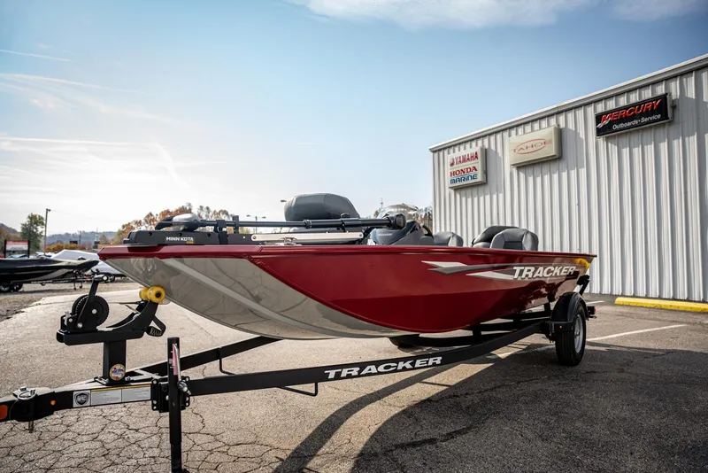Slide: The Image of 2025 Bass Tracker Pro Team 170 boat on trailer, parked outside dealership. - 3