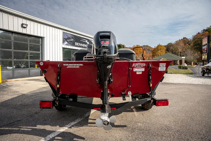 Slide: The Image of 2025 Bass Tracker Pro Team 170 boat, rear view, parked outdoors. - 4