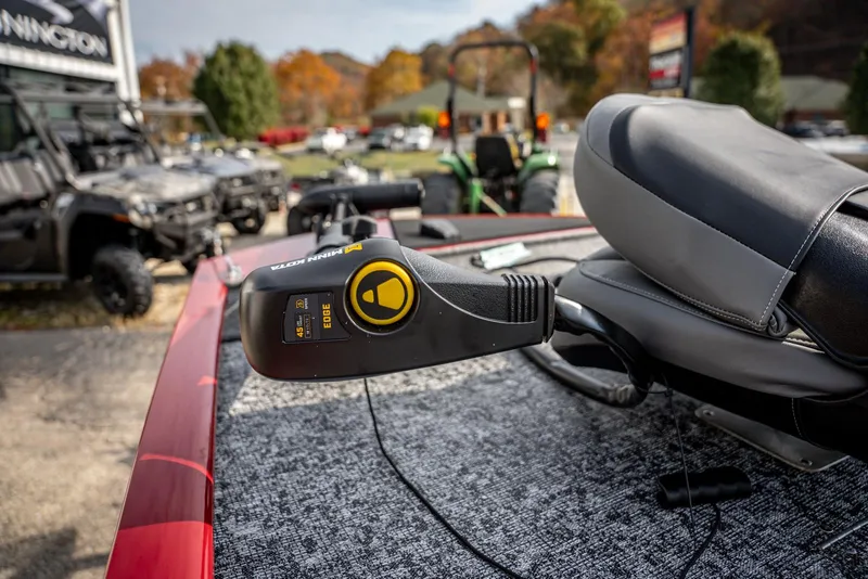 Slide: The Image of 2025 Bass Tracker Pro Team 170 boat interior with control panel and seat. - 7