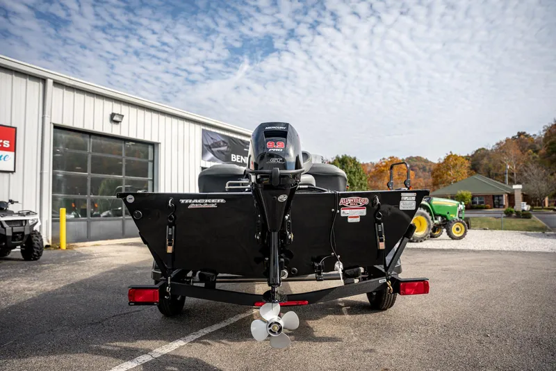 Slide: The Image of 2025 Bass Tracker Pro Team 170 boat parked outside dealership, rear view. - 4