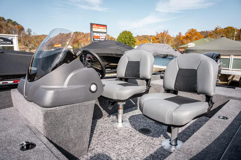 Slide: The Image of 2025 Bass Tracker Super Guide V-16 SC boat interior with two seats and steering console. - 10